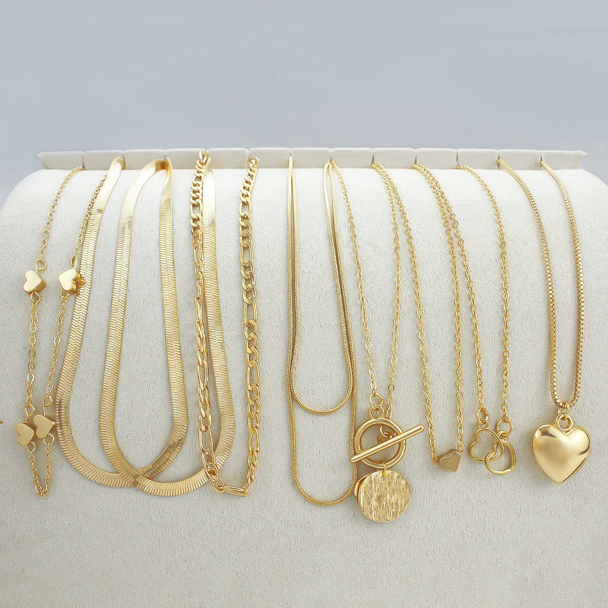 Gold electroplated women's necklace set with 10 jewellery ornaments on snake bone chain