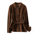 Yellow brown retro-style leather cashmere coat with Peter Pan collar and belt on a hanger.