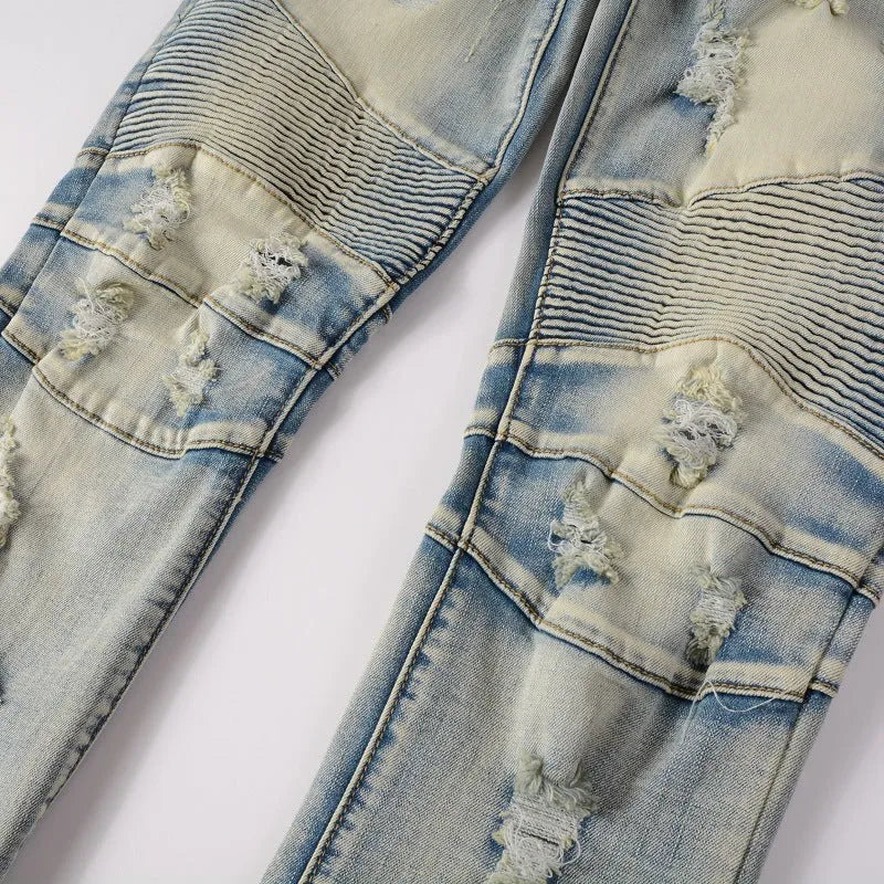 Light blue men's distressed slim fit jeans with hand-frayed details and stretch cotton denim fabric