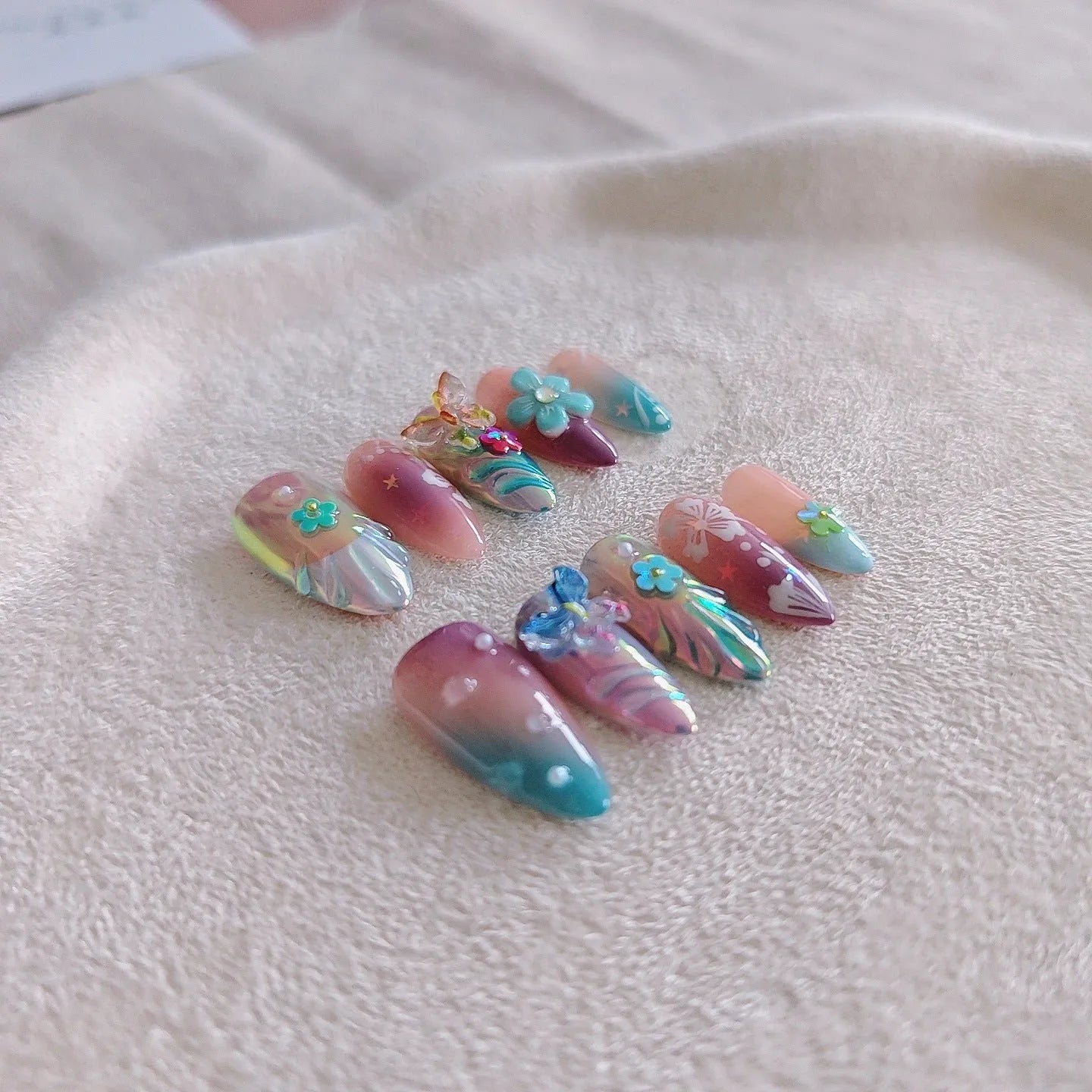 Handmade colourful 3D nail art sculptures of flowers and butterflies in four sizes XS S M L.