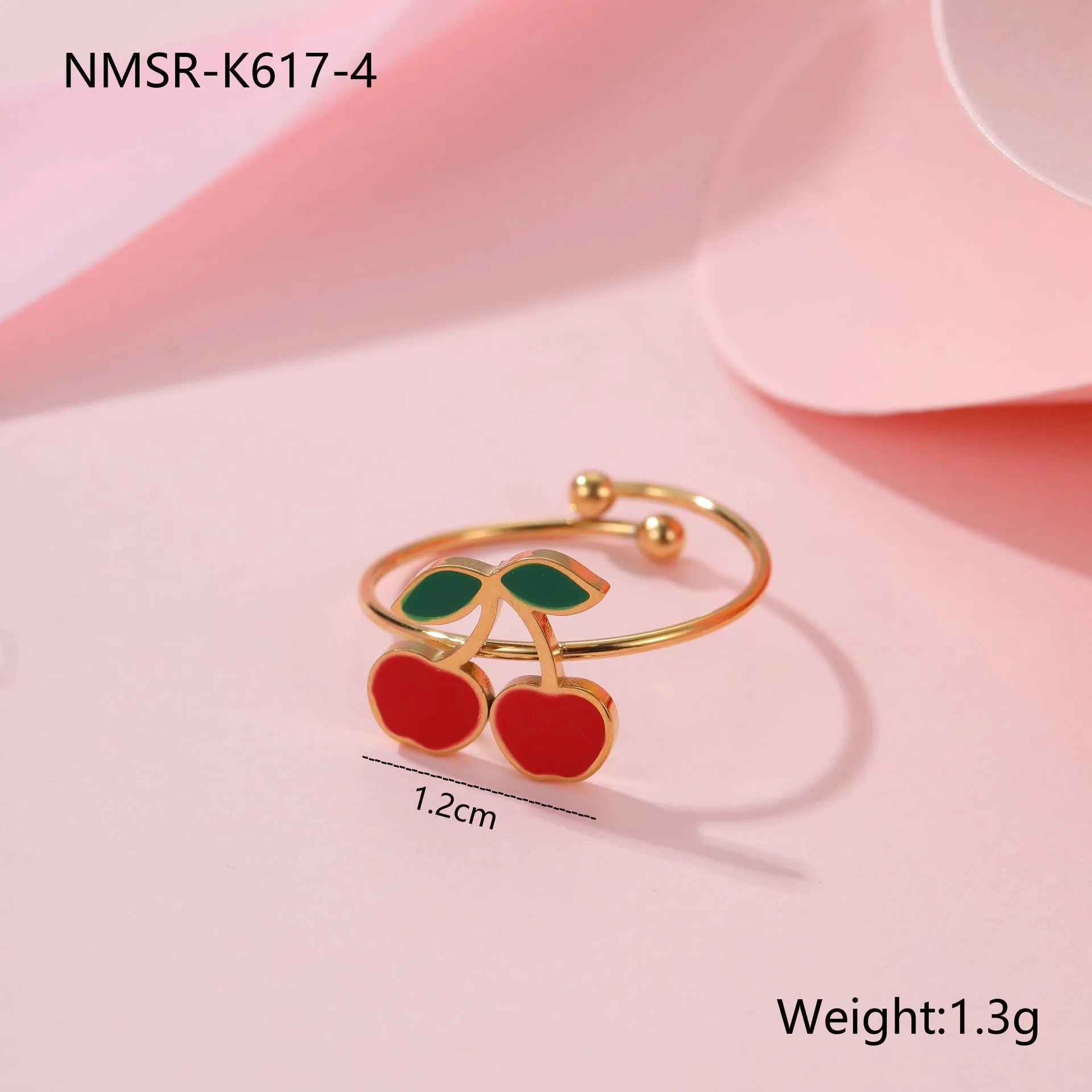 Stainless steel cherry jewellery set showing necklace, bracelet, earrings, and ring with geometric design.