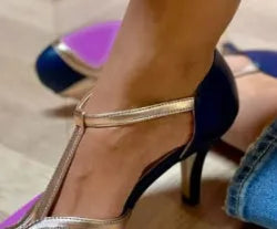 Women's round toe high heel shoe in a two-tone colour with a button fastening on the side.