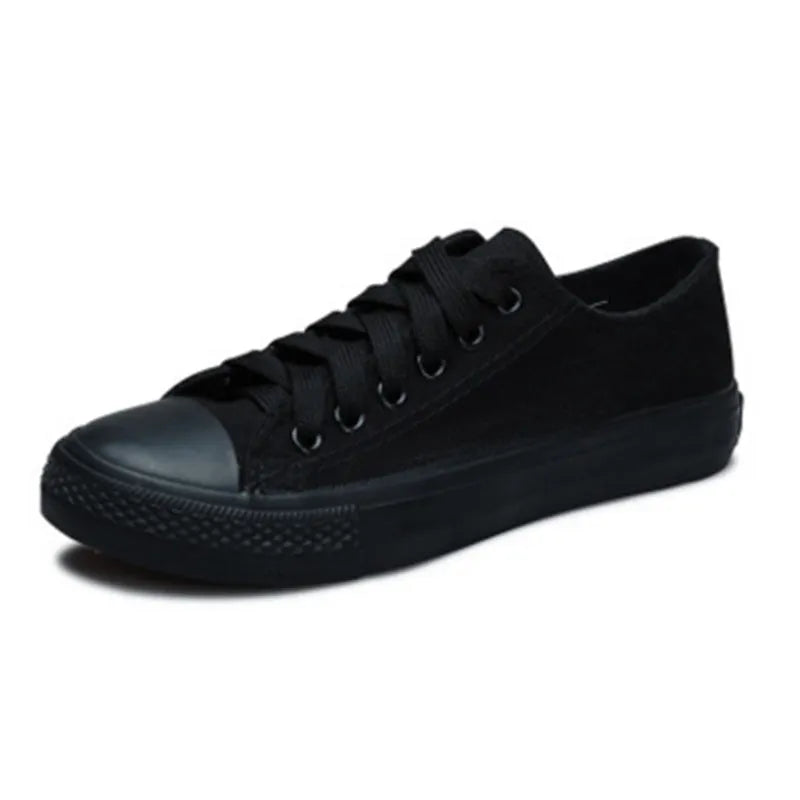 Women's solid colour canvas shoes in black, white and red colourways with casual design