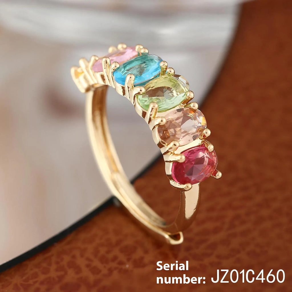 Gold-colour adjustable copper ring with a zircon stone in a simple retro style.