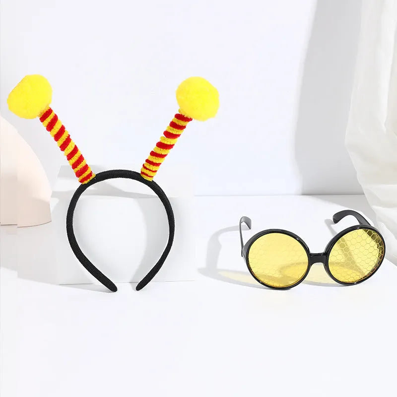 Yellow bee costume headband and matching glasses set on mannequin display