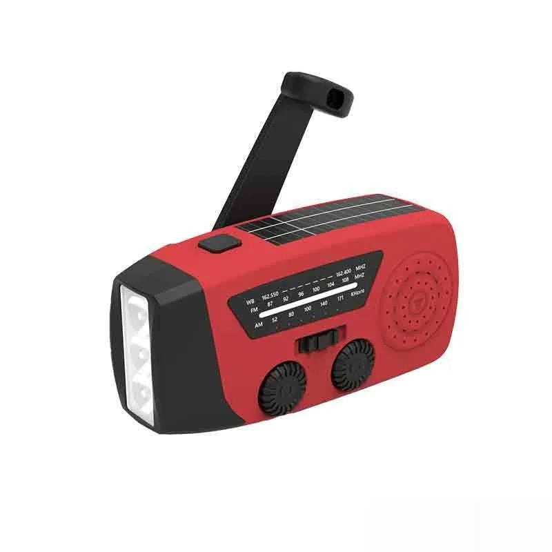 Red rechargeable emergency hand torch with AM/FM radio and wrist strap for disaster preparedness