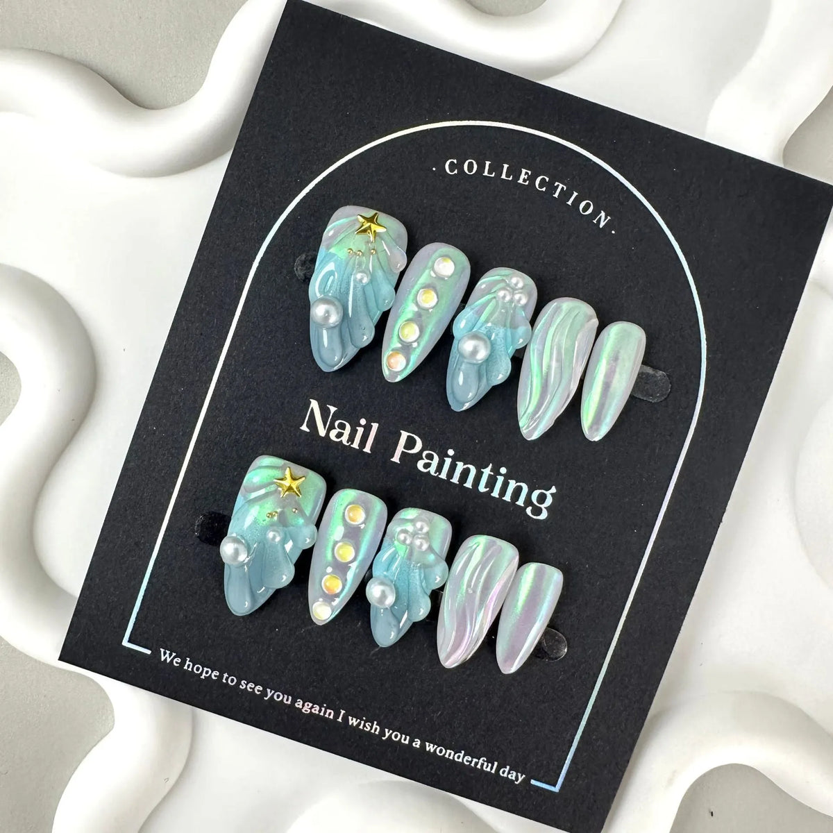 Blue shell-design plastic artificial nail tips set with four size options XS S M L