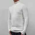Man wearing a green half-turtleneck zip-up sweater, a casual pullover for spring or autumn.