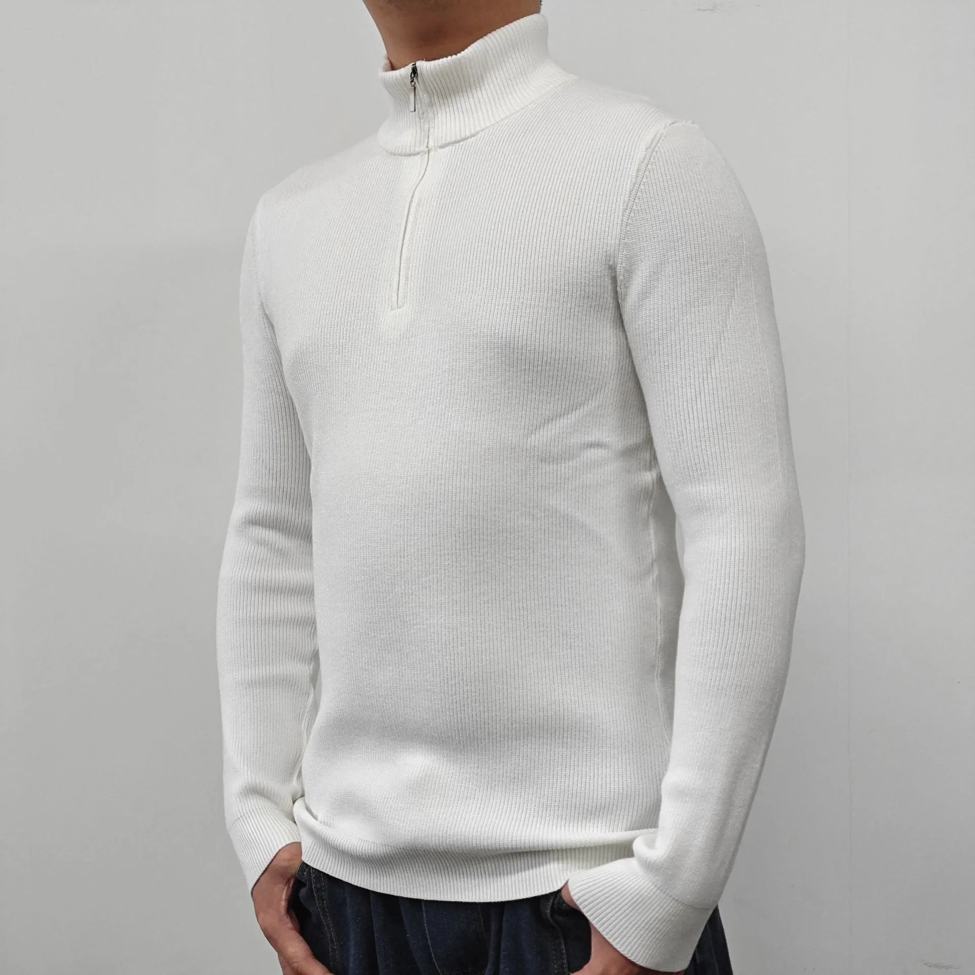 Man wearing a green half-turtleneck zip-up sweater, a casual pullover for spring or autumn.
