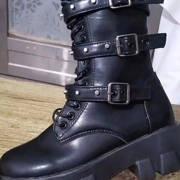 Women's black mid-calf knight boots with a metal buckle strap and side zipper on a round toe.