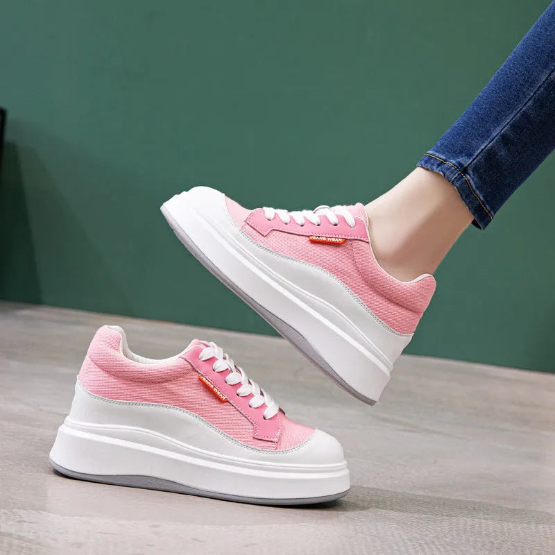 Beige and pink women's leather board shoes with thick soles on a white background.
