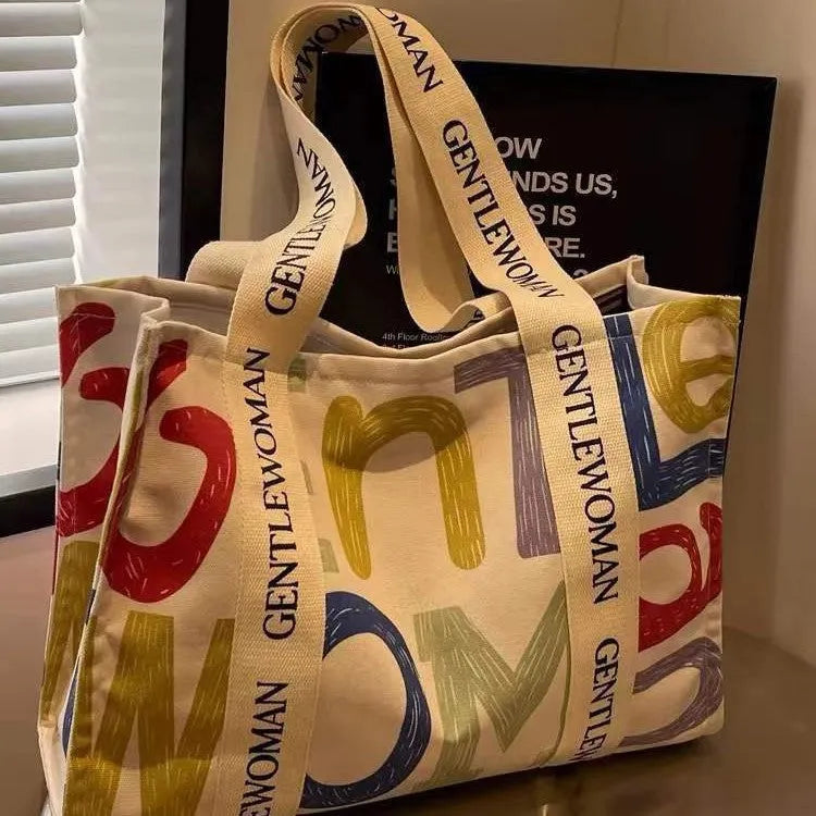 Canvas tote bag with printed design, large capacity for shopping and travel