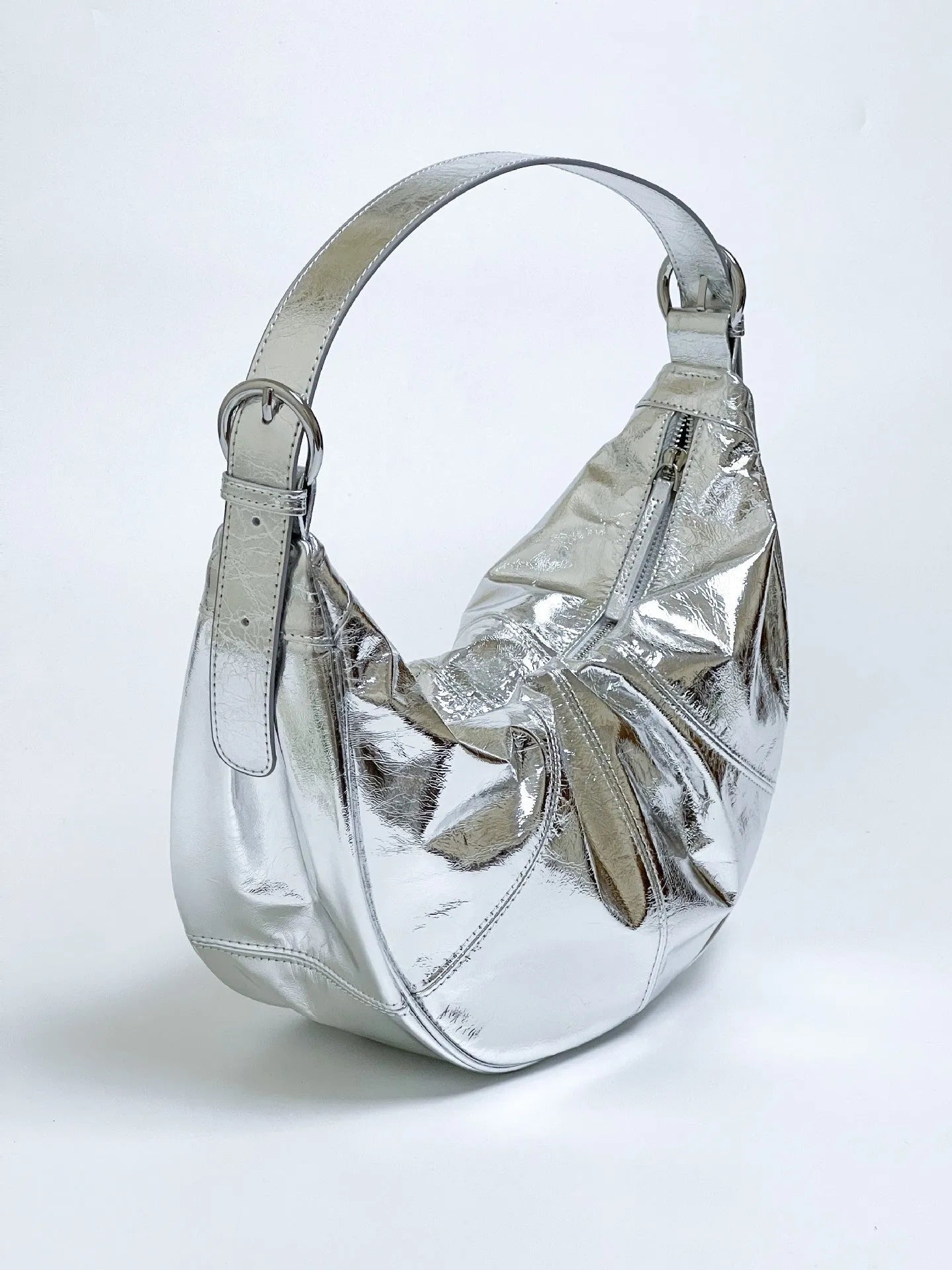 First layer cowhide shoulder bag in dumpling shape with double joint strap and sandwich pocket available in multiple colours