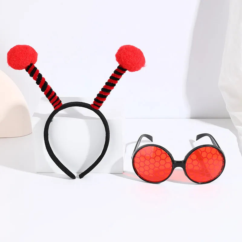 Yellow bee costume headband and matching glasses set on mannequin display