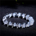 Women's white crystal ghost pyramid bead bracelet with Ruyi symbol design.