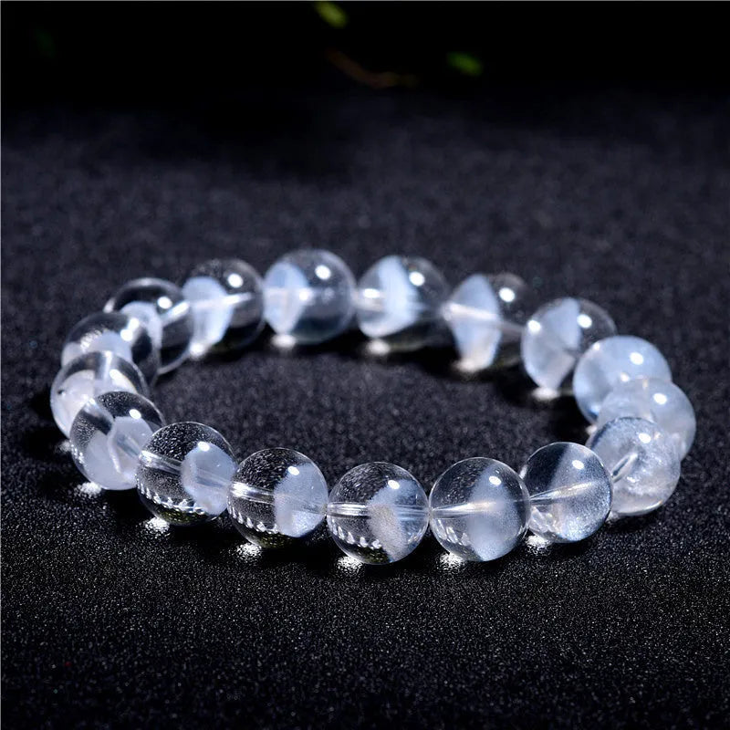 Women's white crystal ghost pyramid bead bracelet with Ruyi symbol design.