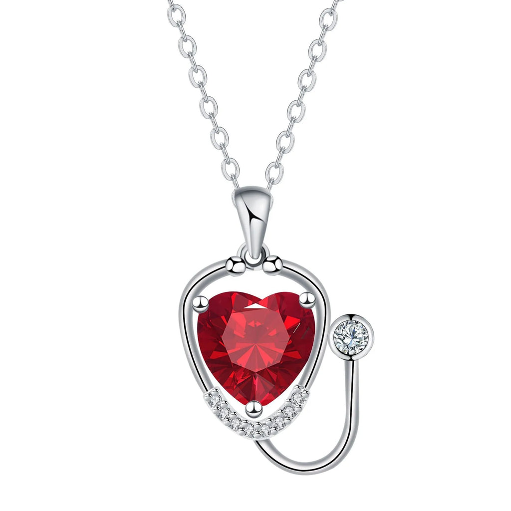 Women's copper electroplated stethoscope wings cross necklace in red diamond colour