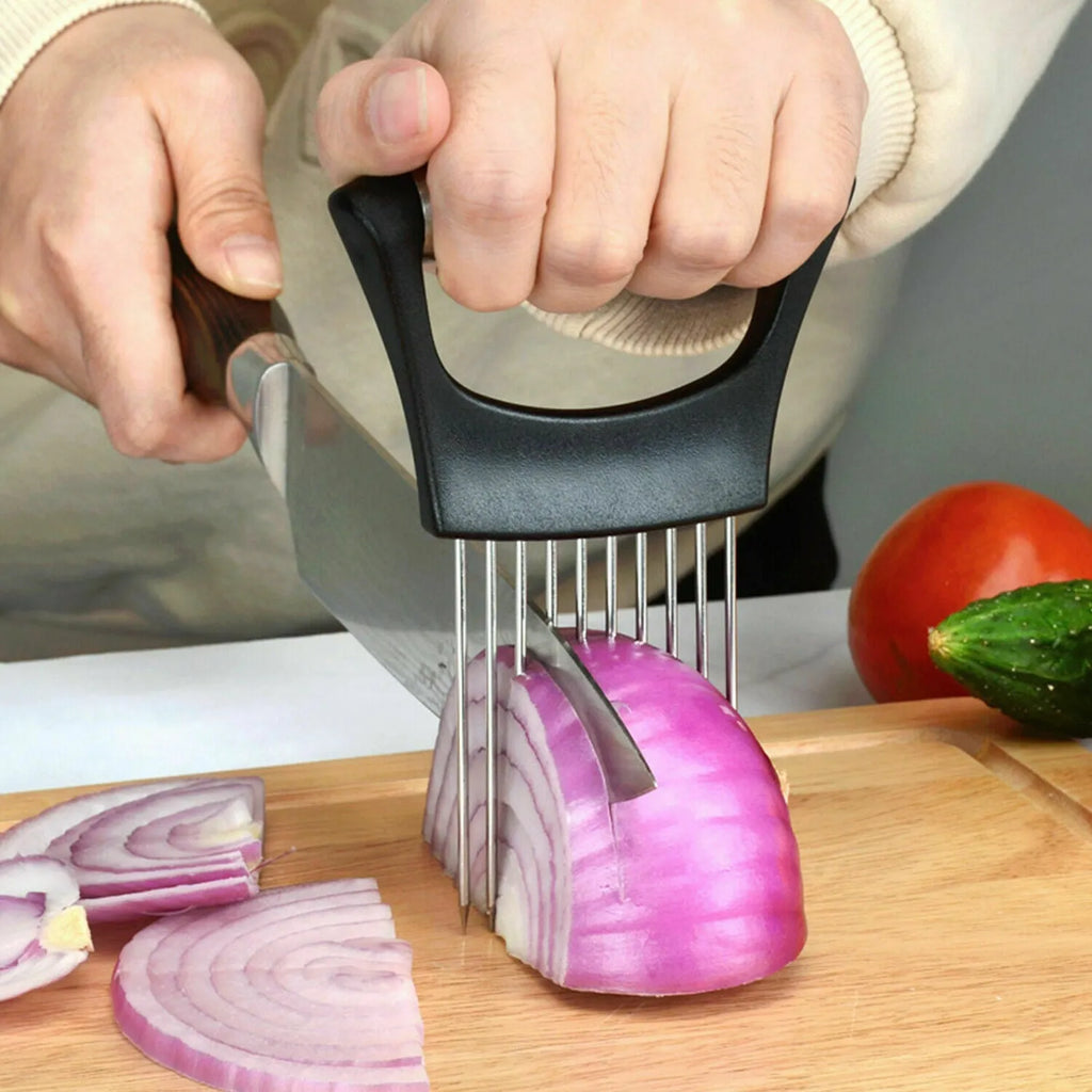 Stainless steel and plastic food slicer holder for onions and tomatoes on a kitchen worktop