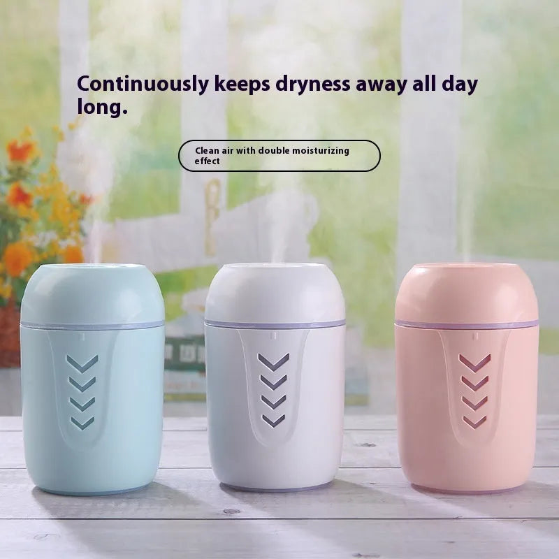 Compact round portable air purifier in blue colour with USB cable for car or desk use.
