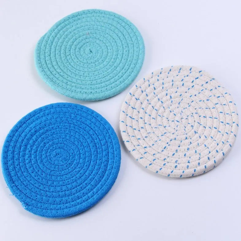 Three round 18cm cotton cord coasters in a set, shown in a blue colour option.