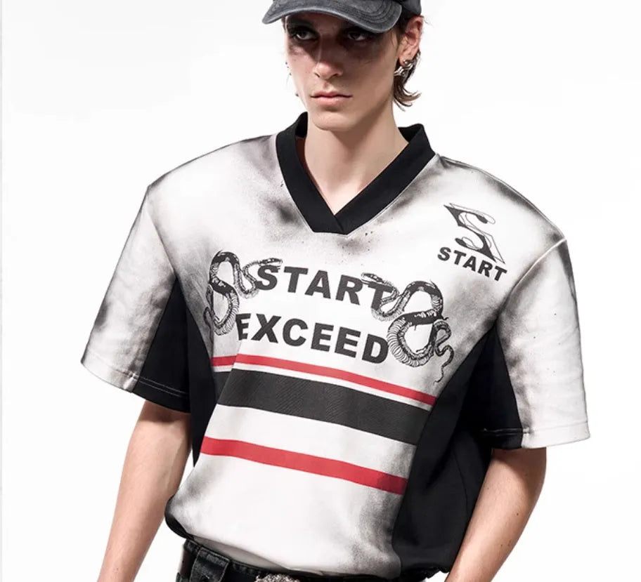 Korean-style women's V-neck short sleeve top with padded shoulders and a black and white letter snake pattern print.
