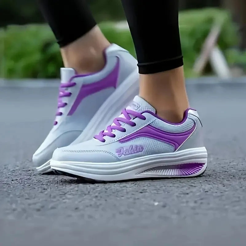 Women's heelless sports travel shoe in a mid-heel style, shown in a selection of available colours.
