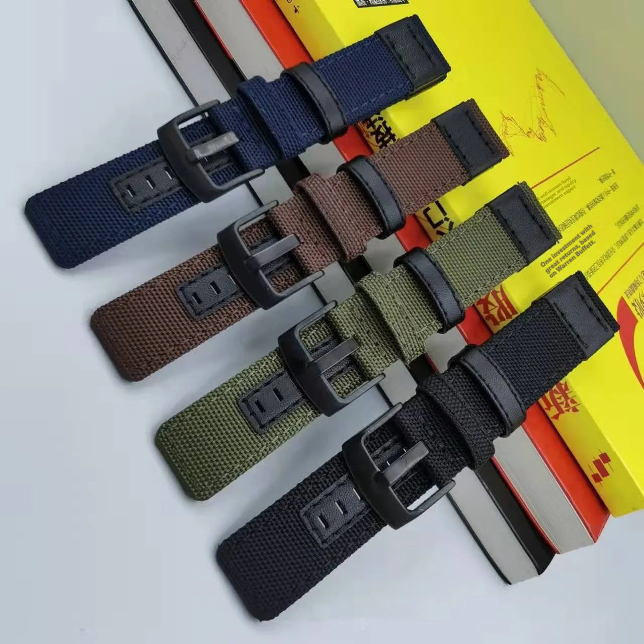 Oxford cloth watch strap in multiple colours showing short and extended length options.