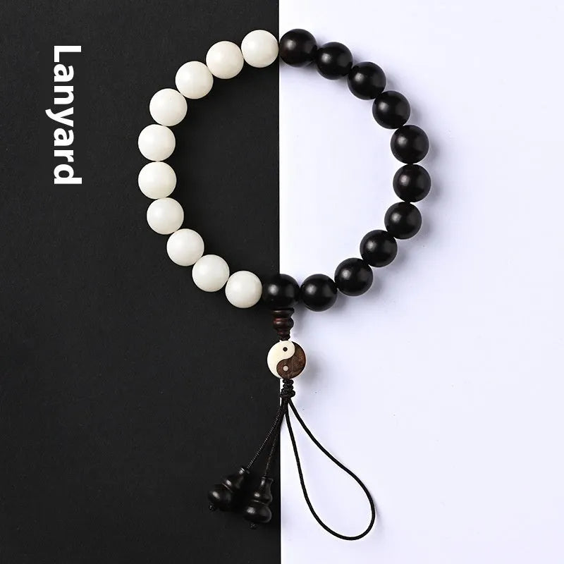 Handmade retro bracelet with White Corypha Umbraculifea Blackwood and Mixed Yuan Beads on a lanyard.