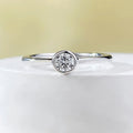 Minimalist silver crown-shaped ring with linear engraving detail in gold or platinum electroplated finish.
