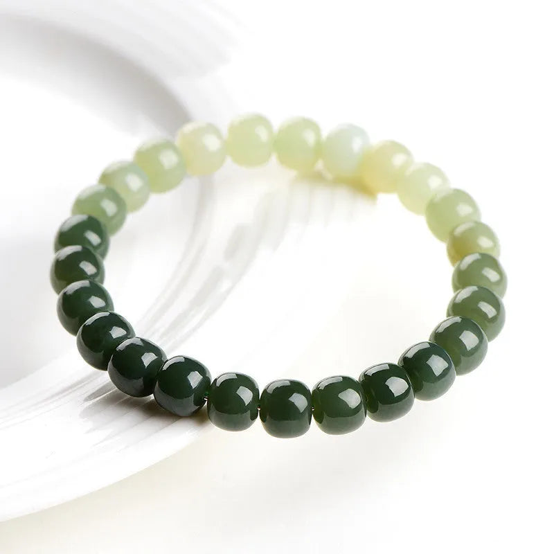 Natural Hetian jade water gradient bracelet with polished beads on an adjustable cord.