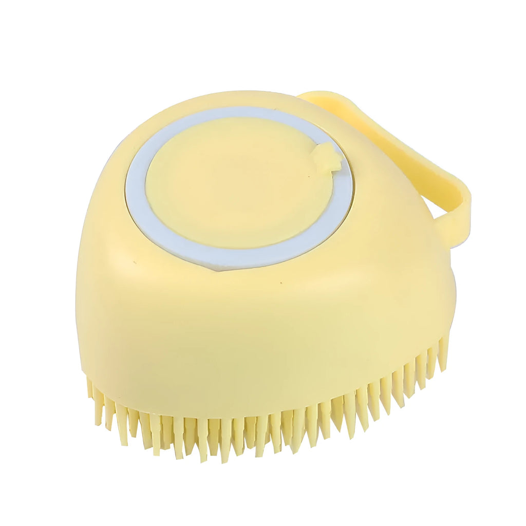 Blue silicone dog bath brush with soft bristles, shown on a hand.