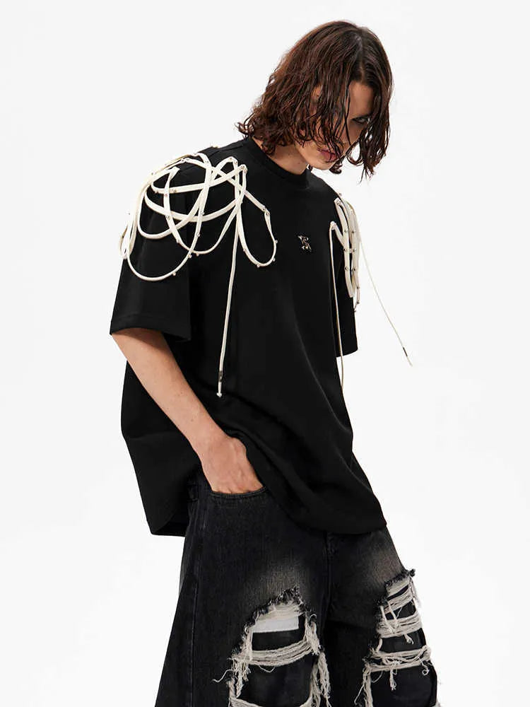 Black loose fit t-shirt with padded shoulders featuring rivet ribbon detail