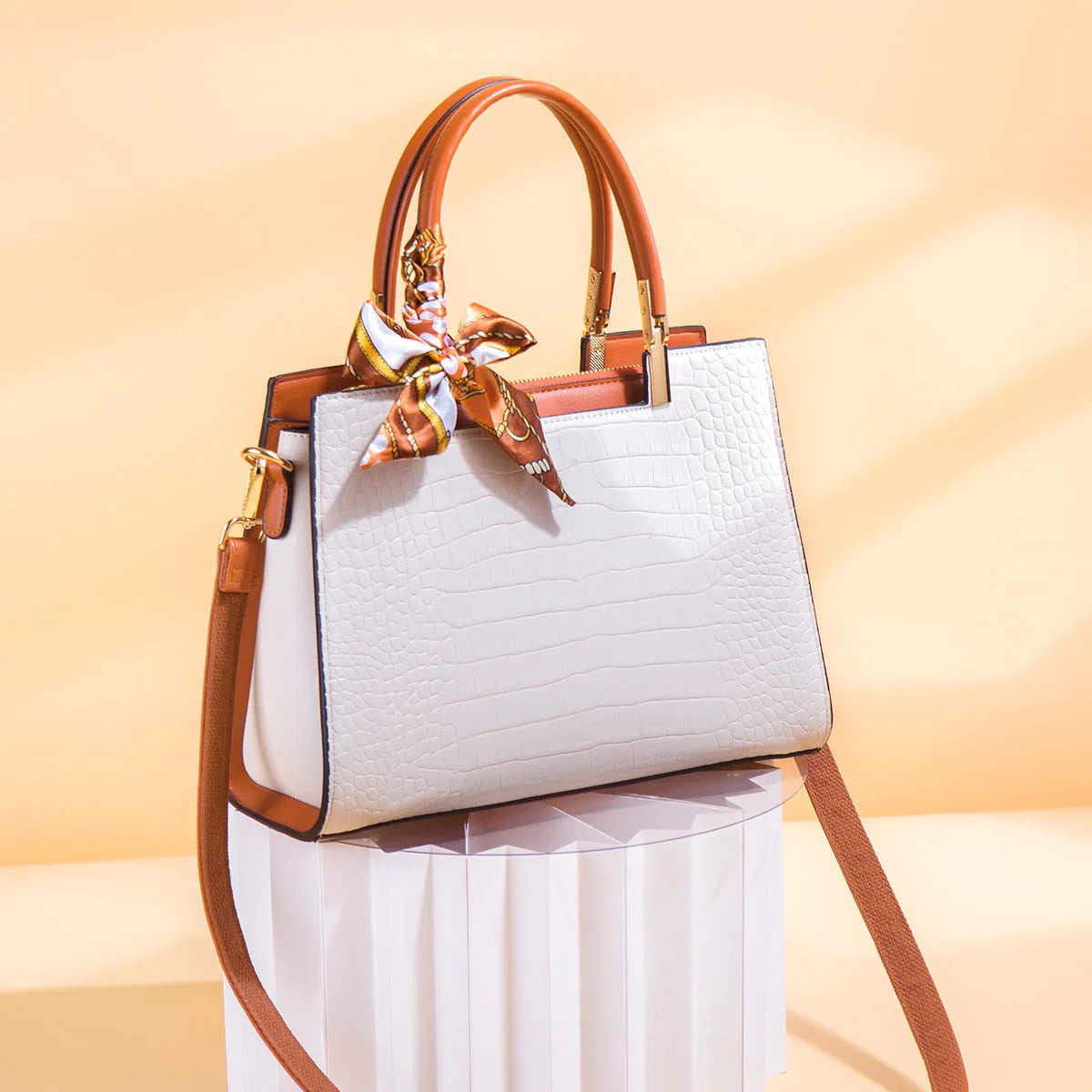 Milky white women's shoulder handbag showing slit pocket and multiple interior compartments