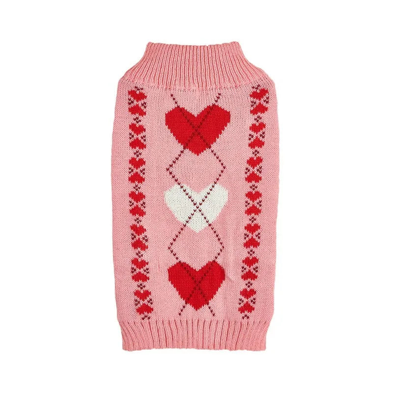 Red dog sweater with love heart design and bow decoration on small dog