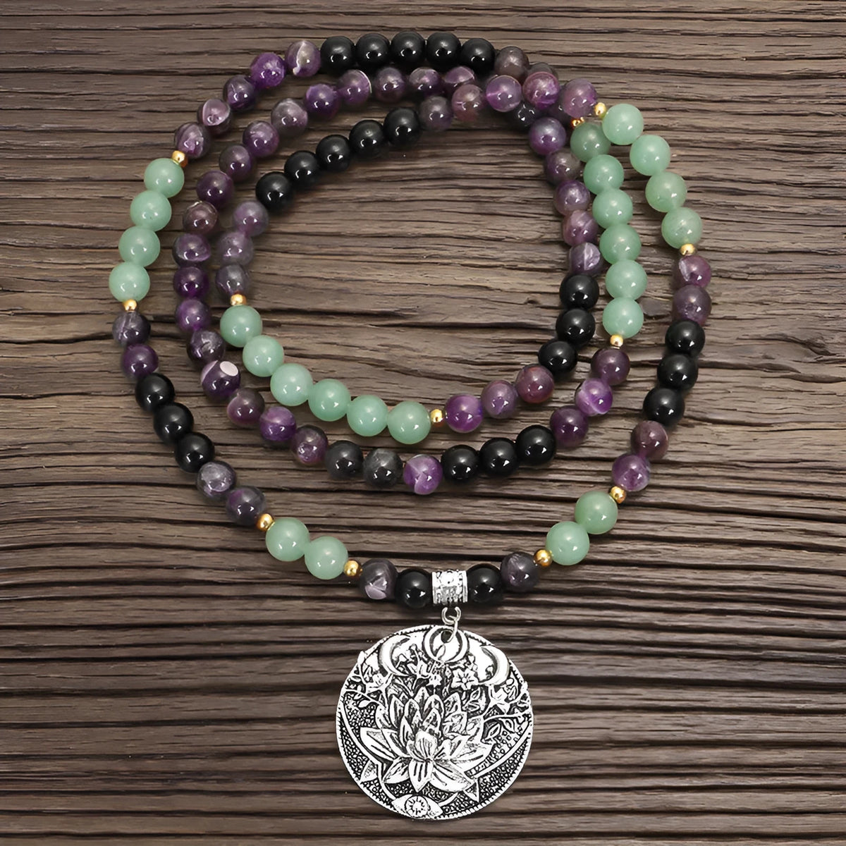 Dongling Long handmade stone bead necklace with alloy lotus pendant and matching bracelet.