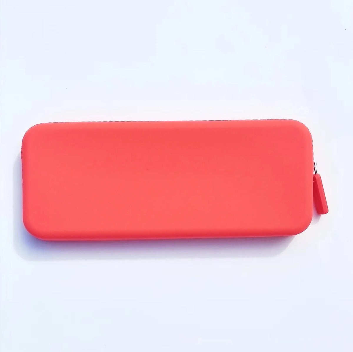 Slim black silicone makeup brush storage bag with zipper, shown next to makeup brushes.