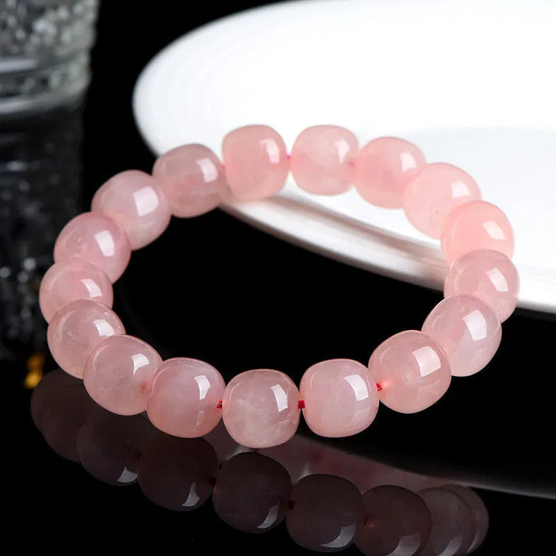 Natural pink crystal bracelet with barrel-shaped geometry beads measuring 8 x 10mm