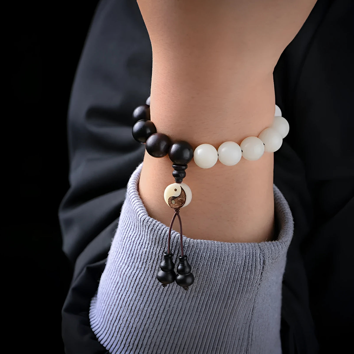 Handmade retro bracelet with White Corypha Umbraculifea Blackwood and Mixed Yuan Beads on a lanyard.
