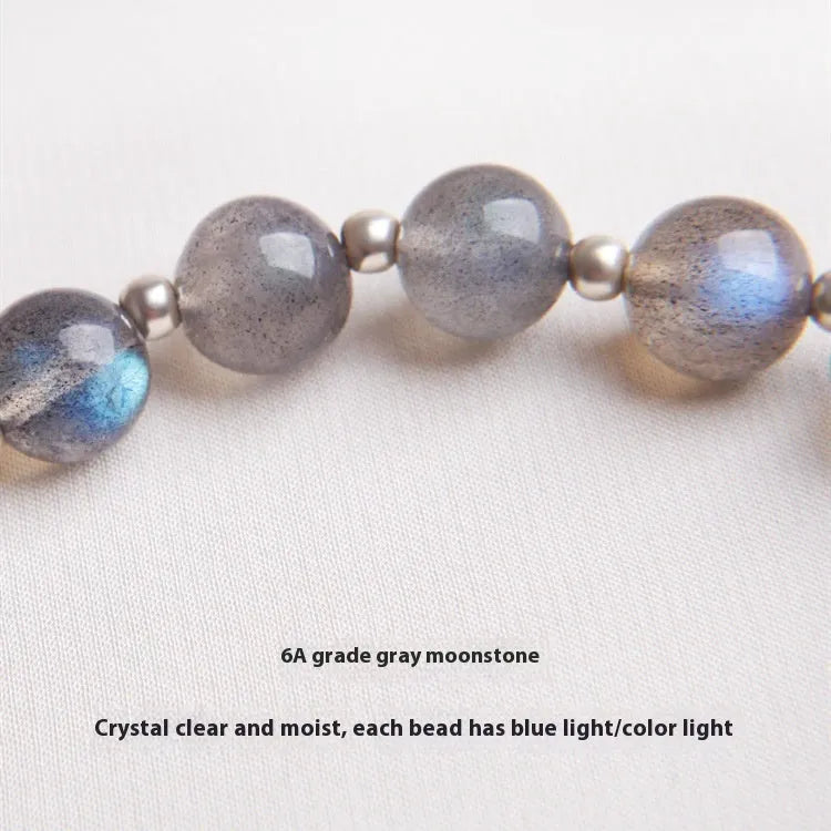 Women's 925 sterling silver bracelet with a grey moonlight stone bead and adjustable clasp.