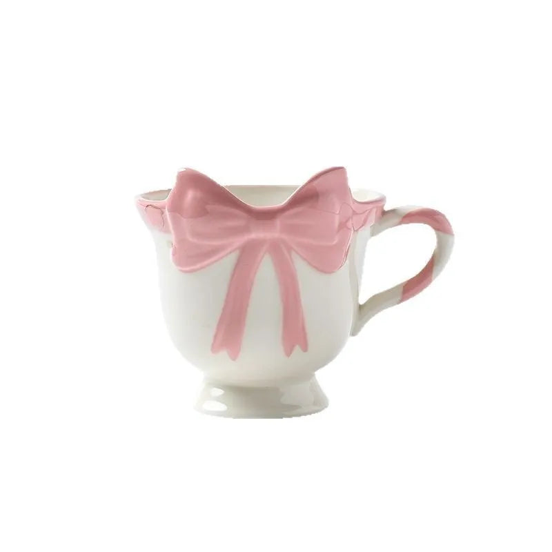 Ceramic mug with heart and bow design in black pink or white powder colour, 301-400ml capacity