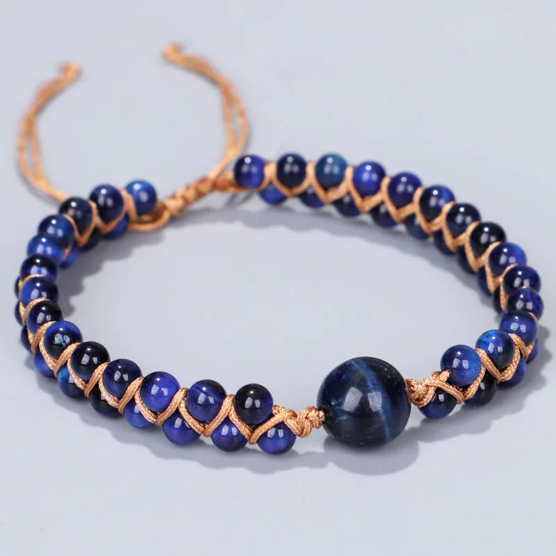 Handwoven geometric pull bracelet with blue tiger eye stone beads.
