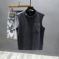 Loose fit cotton sleeveless t-shirt in black on a hanger, showing straight hem design.