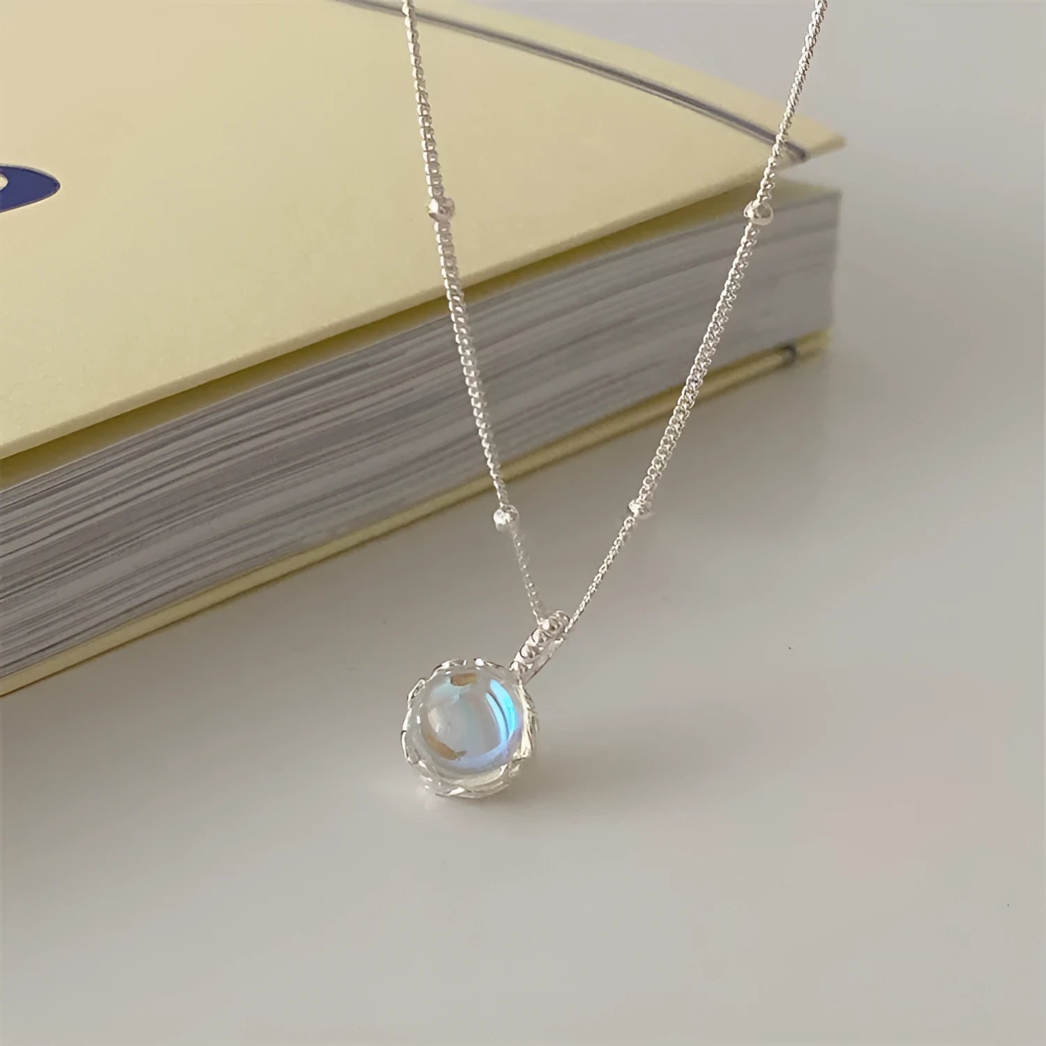 Women's silver necklace with geometry ornamental stone pendant on curb chain