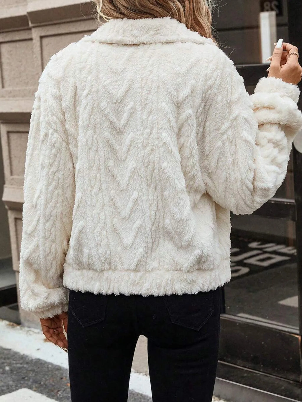 Women's ivory white double-sided plush button cardigan on a hanger