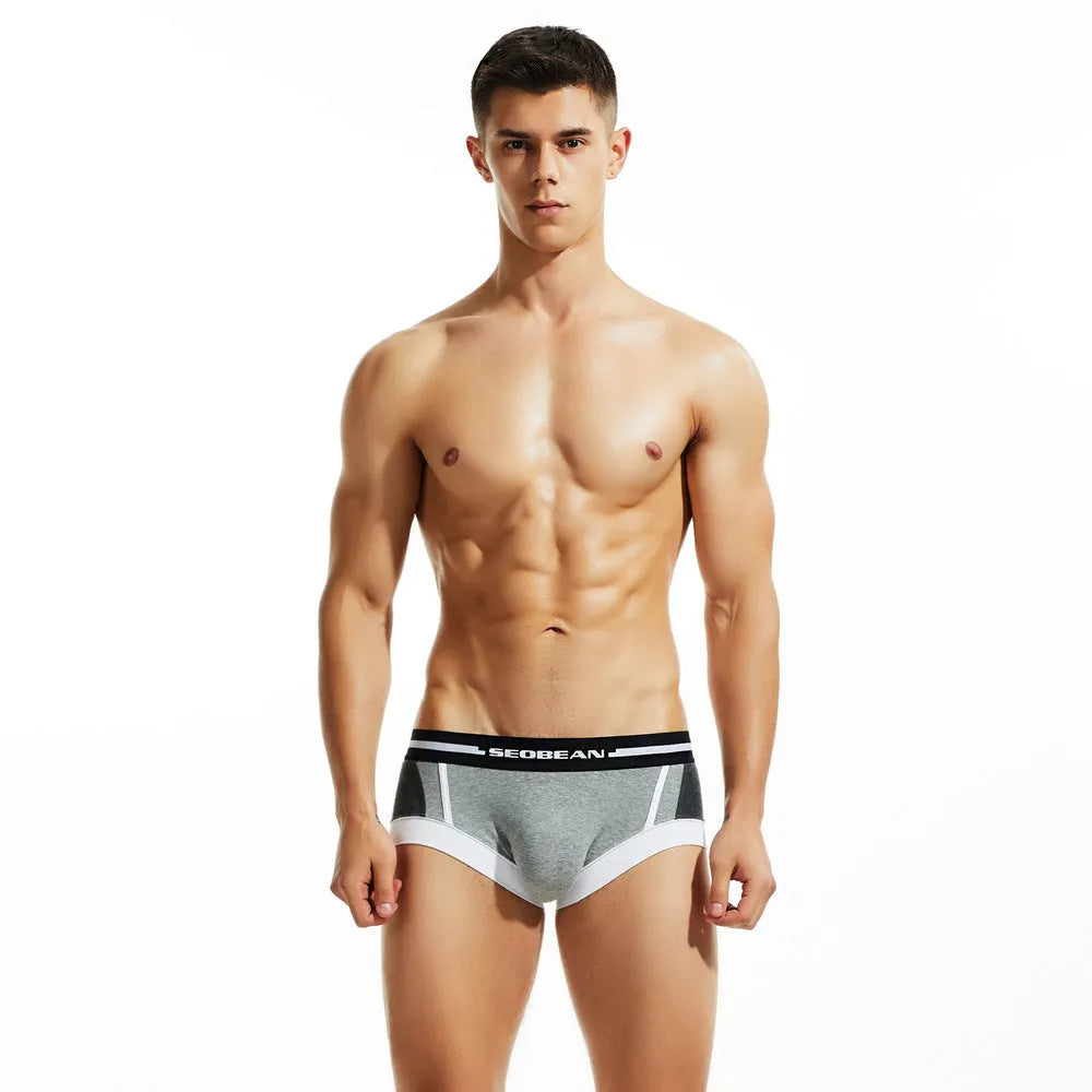 Men's cotton low waist boxer shorts in red, dark blue, and light grey colours on a size chart.