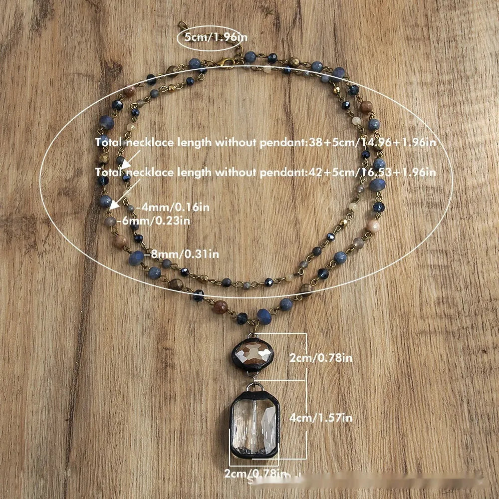 Two-layer tribal-style chain necklace with glass pendant and stone elements in beige and blue colour options