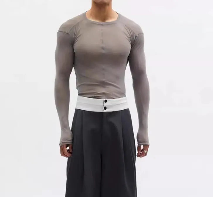 Black mesh see-through slim-fit long sleeve pullover top with round collar on a mannequin.