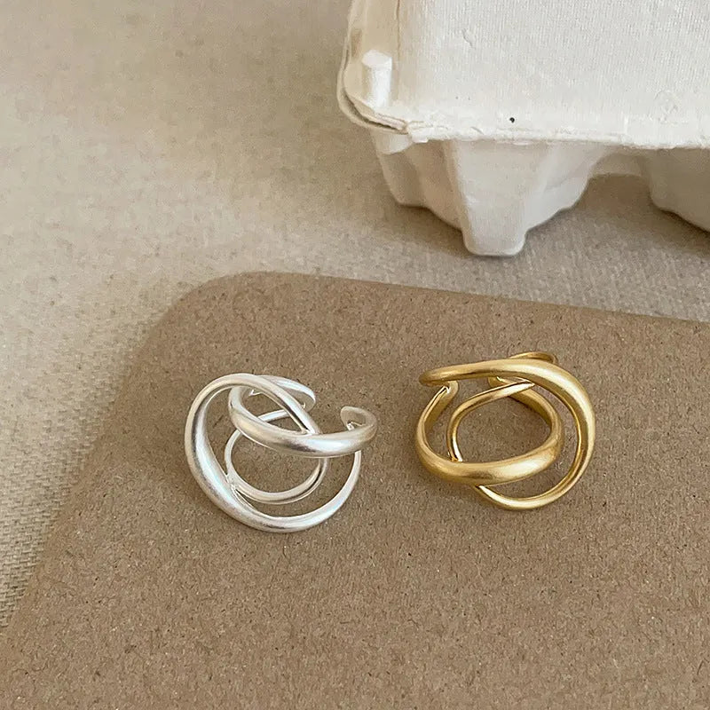 Women's matte metal open ring with three-dimensional interlaced geometric design in gold or silver finish