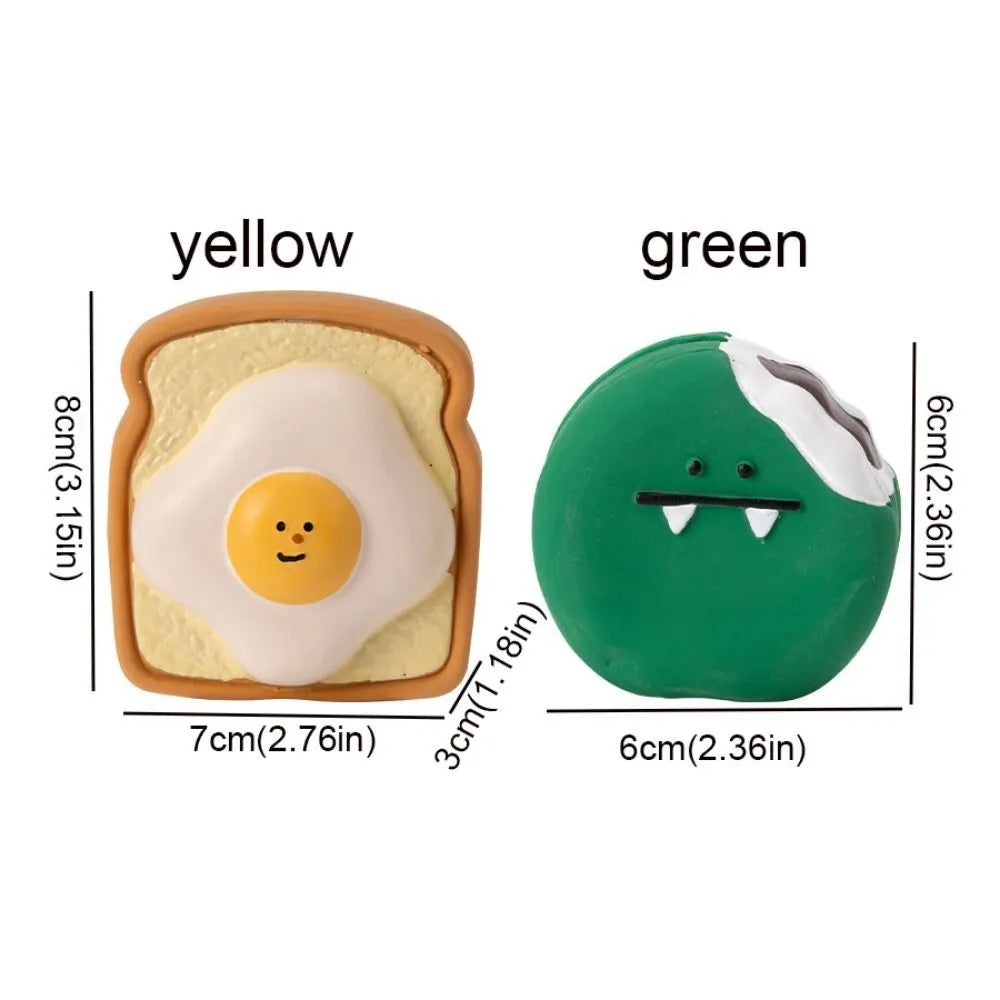 Yellow latex dog chew toy shaped like cartoon bread with egg pattern design