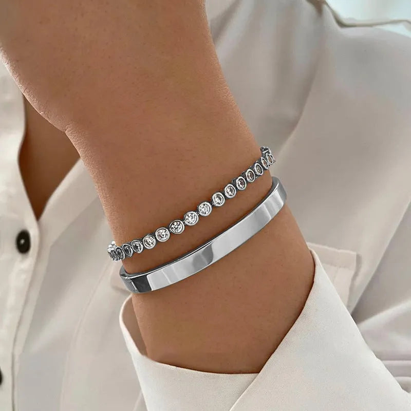 Gold and silver electroplated zinc alloy charm bracelet set with drop, geometric and water droplet details